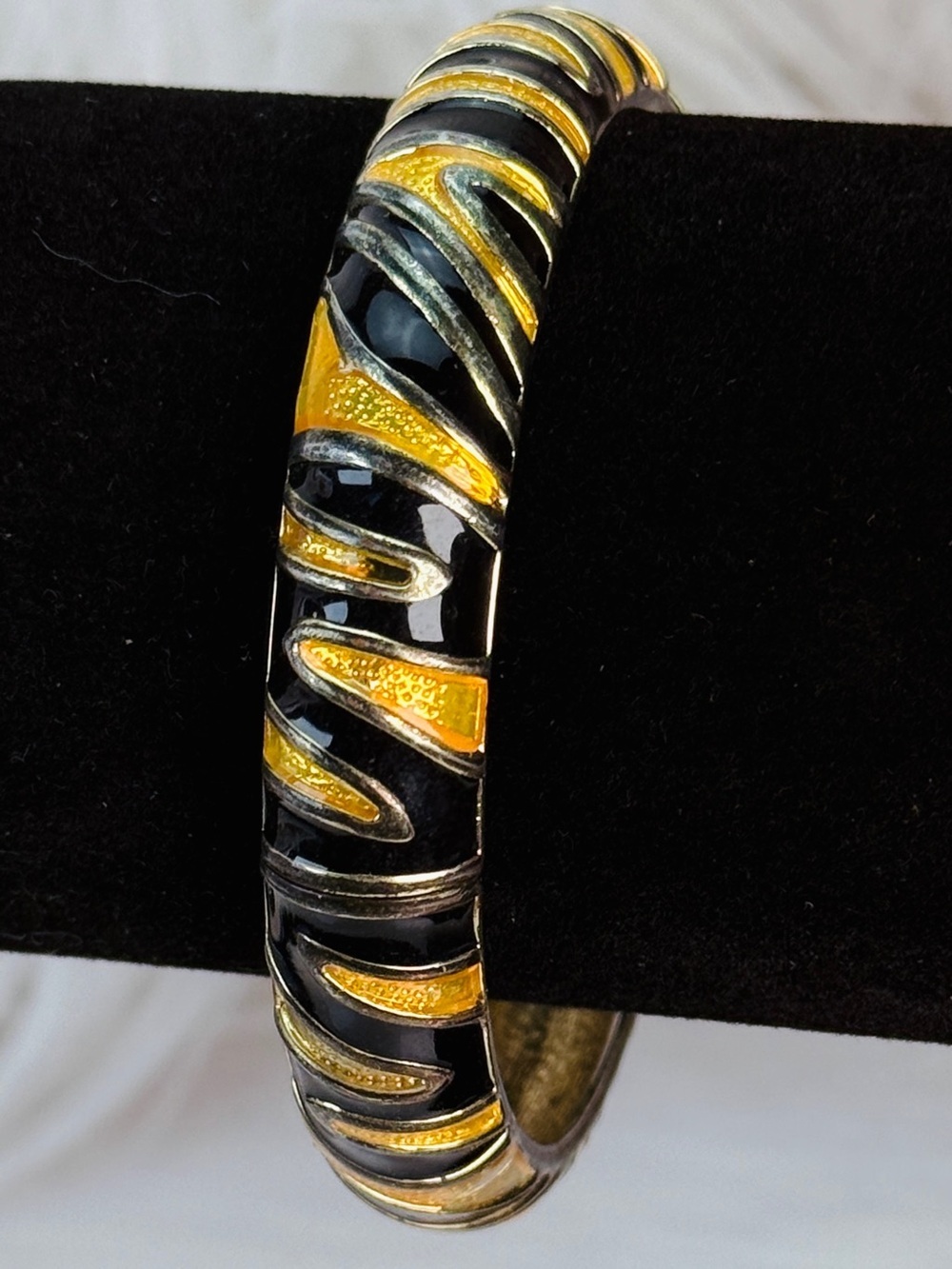 Vintage black and mustard tone swirl, hinged, bangle bracelet
